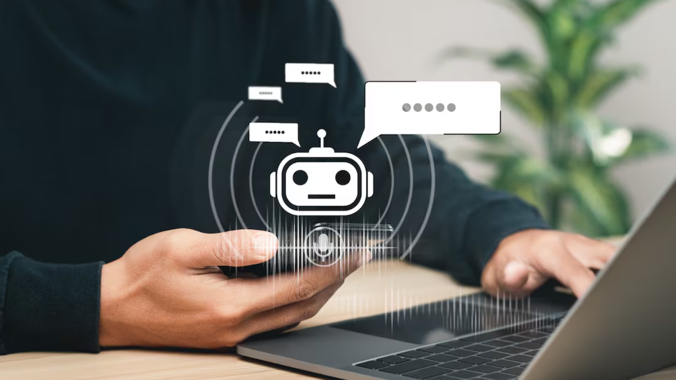 Como Usar a Inteligência Artificial? 7 Dicas Valiosas Para o Seu Negócio 4 Um ícone de microfone e ondas sonoras também estão visíveis, sugerindo comando de voz ou entrada de áudio. A mão direita da pessoa está digitando no teclado do laptop. A imagem transmite a ideia de interação humana com sistemas de Inteligência Artificial, como chatbots ou assistentes virtuais, em um ambiente de trabalho ou estudo.